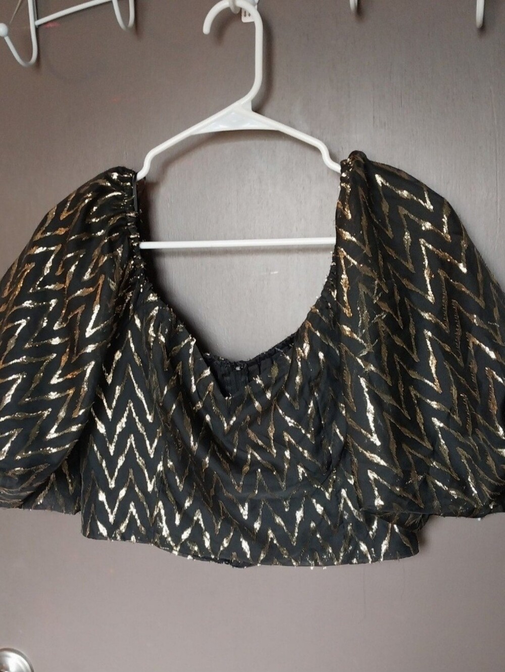 Black crop top with metallic gold zigzag pattern
